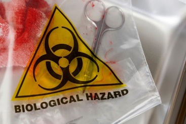 A biological hazard bag with bloody contaminated material inside.